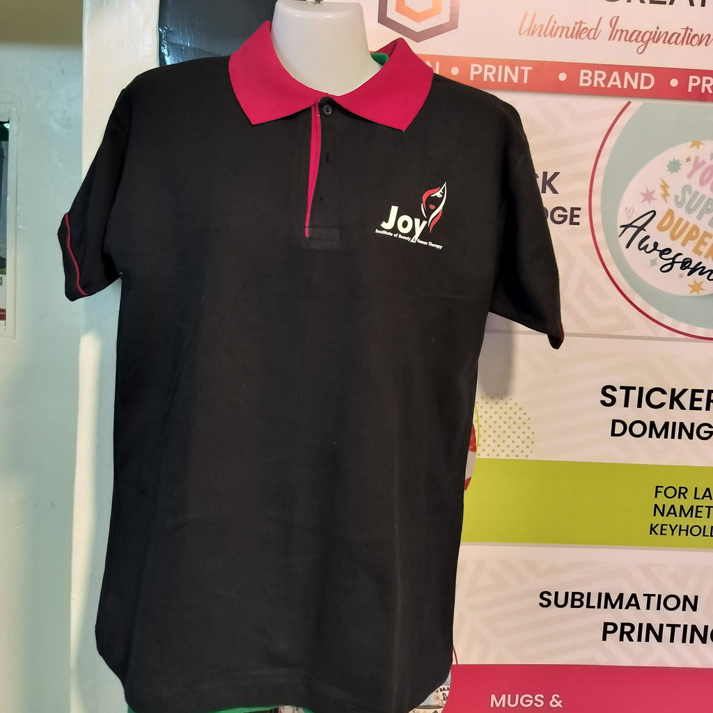 Black polo shirt with pink collar.