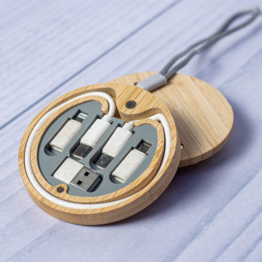 Set of USB cables and connectors in a wooden case on a light blue surface