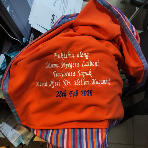 Orange fleece with embroidered text.
